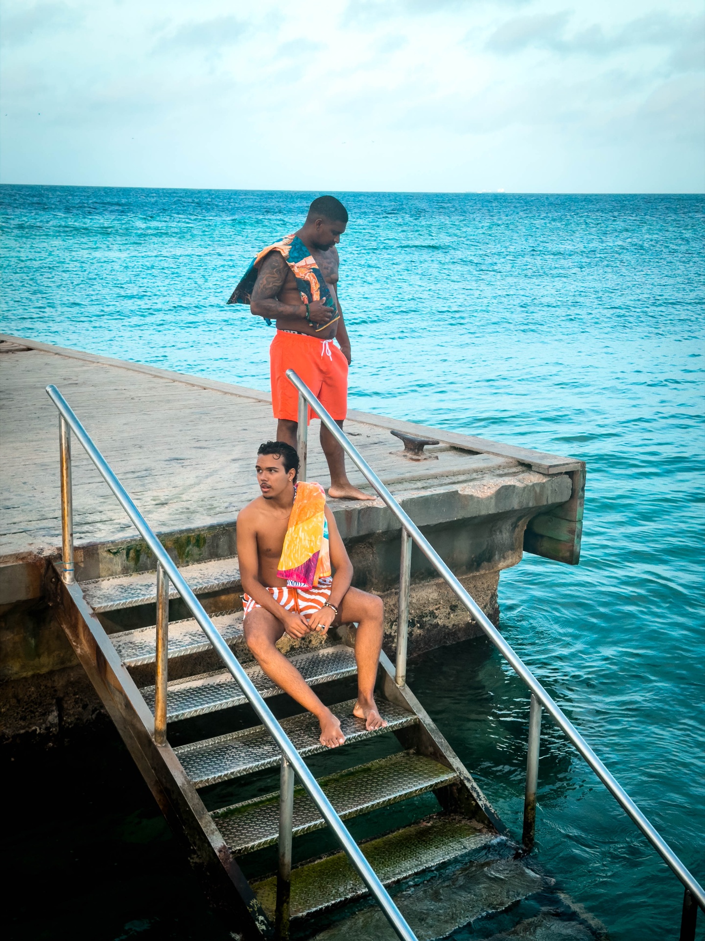 BRO Men's Fashion — resort swimwear styling on the dock steps